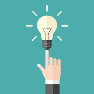 Drawing of a hand pointing to a light bulb signifying an “aha moment” of understanding the importance of marketing strategy.