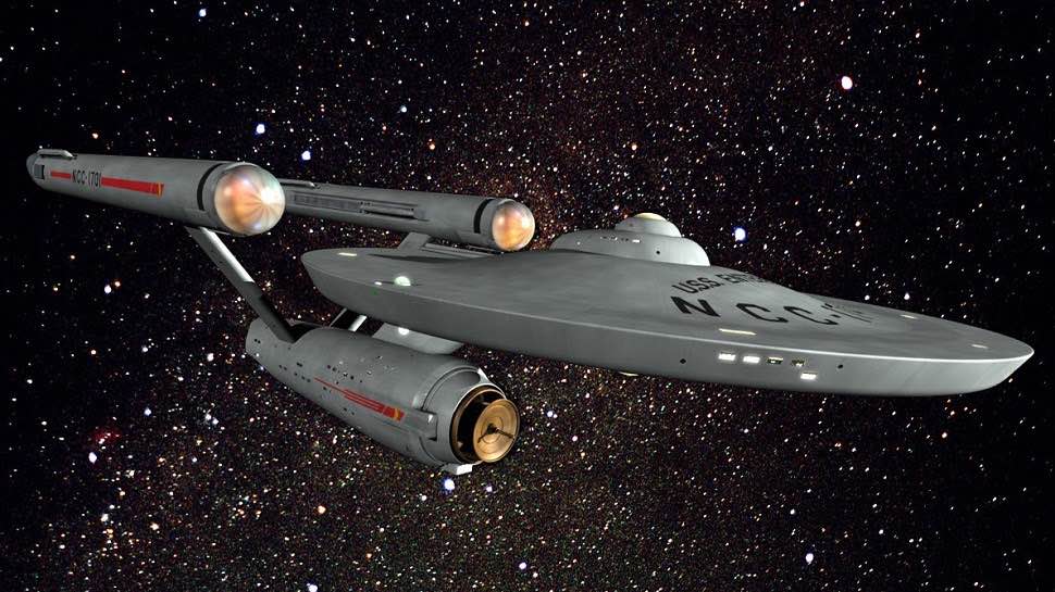 Star Trek Enterprise space ship floating in space among the stars. 